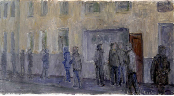 On the street, in front of the building