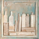 Beige bottles on a pale-blue background